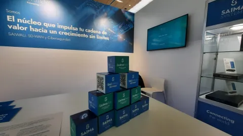 Stand de SAIMA SYSTEMS en ASLAN 2025 presentando SAIWALL Secure SD-WAN y ciberseguridad.